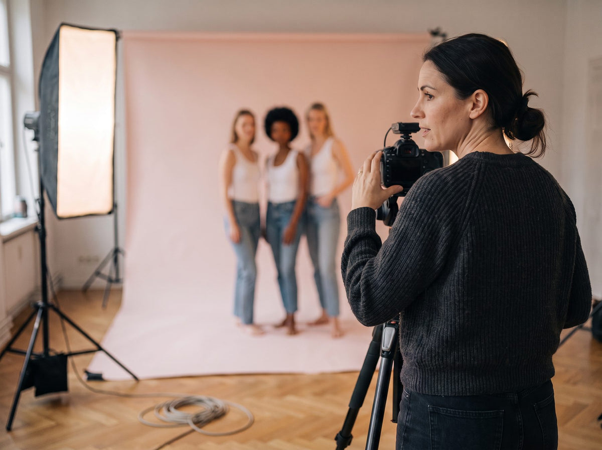 A woman directing the photo shoot on a studio set